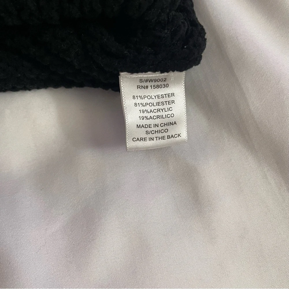 Black crew neck dropped shoulders ribbed trims knit sweater